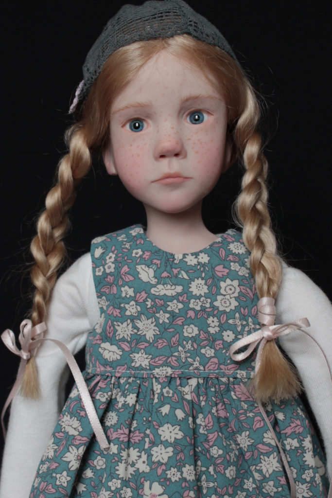 "Petite fille blonde avec un bonnet" - Miniature