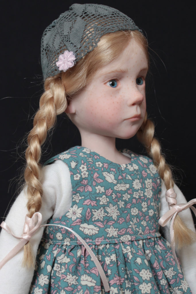 "Petite fille blonde avec un bonnet" - Miniature